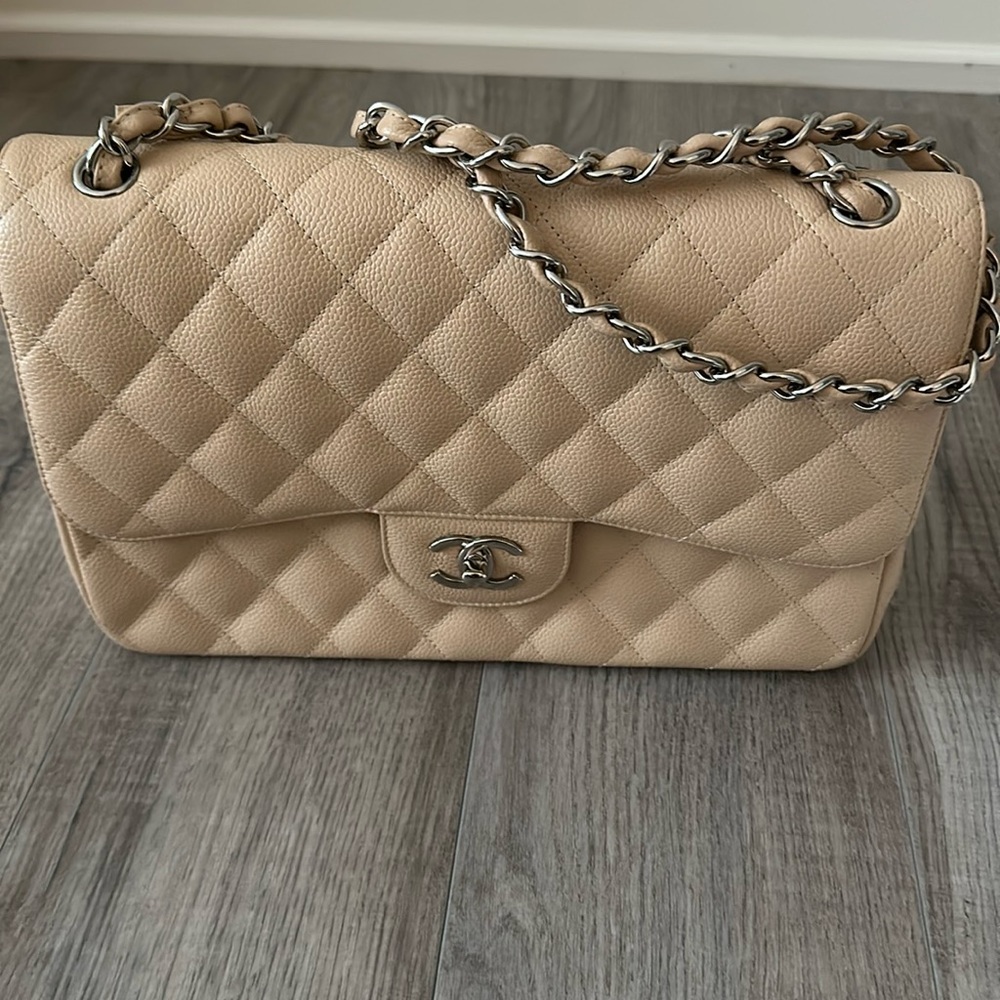 Authentic Chanel Beige Caviar Jumbo Double Flap Bag, excellent condition.
